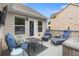 Outdoor deck offers comfortable seating, a small table, and serene backyard views at 648 York View Dr, Auburn, GA 30011