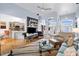 Open-concept living room featuring hardwood floors and neutral decor flows into the kitchen at 648 York View Dr, Auburn, GA 30011