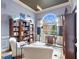 Charming office with large window, built-in shelving and a cozy seating area at 648 York View Dr, Auburn, GA 30011