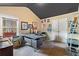 Home office with vaulted ceiling, gray walls, unique desk, and natural light from a large window at 648 York View Dr, Auburn, GA 30011