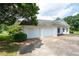 Spacious two-car garage with additional parking space and well-kept landscaping at 2692 Wellington Dr, Marietta, GA 30062