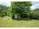 Backyard storage shed surrounded by mature trees and landscaping at 2692 Wellington Dr, Marietta, GA 30062