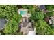 Aerial view of the home with a backyard pool surrounded by lush greenery at 3616 Blakeford Ct, Marietta, GA 30062