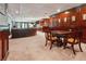 Finished basement with a bar, living area, plush carpet, and wood trim at 3616 Blakeford Ct, Marietta, GA 30062