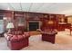 Basement living area showcasing a cozy fireplace and elegant built-in shelving at 3616 Blakeford Ct, Marietta, GA 30062