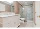 Bright bathroom featuring marble floors, a glass-enclosed shower, and a white vanity at 3616 Blakeford Ct, Marietta, GA 30062
