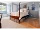 Airy bedroom with carpet, a four-poster bed, and a window bench for sitting at 3616 Blakeford Ct, Marietta, GA 30062