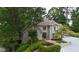 Charming home featuring manicured landscaping, mature trees, and a welcoming front entrance at 3616 Blakeford Ct, Marietta, GA 30062