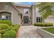 Elegant home showcasing a grand front entrance with stone walkway and manicured shrubs at 3616 Blakeford Ct, Marietta, GA 30062