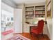 Bright home office featuring built-in bookshelves, a desk, and hardwood floors at 3616 Blakeford Ct, Marietta, GA 30062