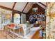 Elegant living room with vaulted ceilings, wood paneling, and built-in bookcases, creating a sophisticated ambiance at 3616 Blakeford Ct, Marietta, GA 30062