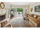 Bright living room with fireplace, opens to a deck, and showcases elegant decor and comfortable seating at 3616 Blakeford Ct, Marietta, GA 30062