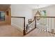Upstairs hallway featuring carpet, white railings, and a decorative chandelier at 3616 Blakeford Ct, Marietta, GA 30062
