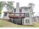 Spacious two-story home with a large wooden deck, neutral siding, and a walk out basement at 370 Beracah Sw Trl, Atlanta, GA 30331
