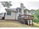 View of a two-story home with neutral siding and large deck overlooking the backyard at 370 Beracah Sw Trl, Atlanta, GA 30331
