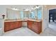 Well-lit bathroom with dual sinks, granite countertops, and a large mirror at 370 Beracah Sw Trl, Atlanta, GA 30331