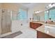 Bright bathroom featuring a glass enclosed shower, soaking tub, and granite countertops at 370 Beracah Sw Trl, Atlanta, GA 30331