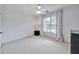 Clean bedroom features light walls, soft carpet, and large window at 370 Beracah Sw Trl, Atlanta, GA 30331