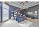 Spacious primary bedroom with a tray ceiling, dark accent wall and windows allowing natural light at 370 Beracah Sw Trl, Atlanta, GA 30331