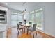 Cozy dining area with a table set for four, next to a kitchen and brightened by natural light at 370 Beracah Sw Trl, Atlanta, GA 30331