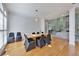 Elegant dining room with hardwood floors, contemporary lighting, and ample natural light at 370 Beracah Sw Trl, Atlanta, GA 30331