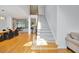 Inviting entryway with hardwood floors, staircase, and views of the dining and living areas at 370 Beracah Sw Trl, Atlanta, GA 30331