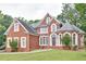 Charming brick facade with detailed trim and well-kept landscaping on a lush green lawn at 370 Beracah Sw Trl, Atlanta, GA 30331