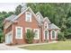 Brick home with attached garage and manicured lawn in a serene, wooded setting at 370 Beracah Sw Trl, Atlanta, GA 30331