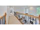 Second story hallway with railing overlooking the living area at 370 Beracah Sw Trl, Atlanta, GA 30331