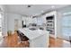 Spacious kitchen with a large island, white cabinetry, stainless steel appliances, and hardwood floors at 370 Beracah Sw Trl, Atlanta, GA 30331