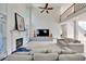 Grand living room with fireplace, soaring ceilings, and open balcony overlooking the space at 370 Beracah Sw Trl, Atlanta, GA 30331