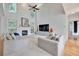 Spacious living room with high ceilings, fireplace, and comfortable seating arrangement at 370 Beracah Sw Trl, Atlanta, GA 30331