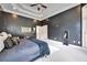Spacious main bedroom features a tray ceiling, plush carpet, and large windows for ample natural light at 370 Beracah Sw Trl, Atlanta, GA 30331