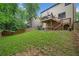 Spacious backyard with a patio and a deck, perfect for outdoor entertaining at 404 Pine Grove Way, Woodstock, GA 30189