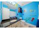 Fun bathroom with granite vanity, a unique nautical mural, and bright blue paint at 404 Pine Grove Way, Woodstock, GA 30189