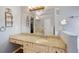 Bright bathroom features a granite countertop, large mirror, and great lighting at 404 Pine Grove Way, Woodstock, GA 30189