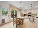 Inviting dining area with a view to the kitchen and backyard, flooded with natural light at 404 Pine Grove Way, Woodstock, GA 30189