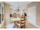 Bright dining area with pendant lighting and a view to the kitchen, perfect for casual meals at 404 Pine Grove Way, Woodstock, GA 30189