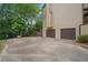 Driveway leading to a two-car garage with plenty of space for parking and a basketball hoop at 404 Pine Grove Way, Woodstock, GA 30189