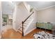 Foyer offers hardwood floors and a staircase leading up to the second floor at 404 Pine Grove Way, Woodstock, GA 30189