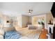 Inviting living room boasts hardwood floors and neutral paint, seamlessly flowing into an open-concept kitchen at 404 Pine Grove Way, Woodstock, GA 30189