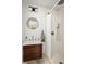 Cozy bathroom featuring a single vanity with wood cabinets, modern fixtures, and a stand up shower at 124 Richmond Se St, Atlanta, GA 30312