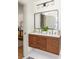 Stylish bathroom featuring a double vanity with sleek wood cabinets and modern fixtures and a neutral palette at 124 Richmond Se St, Atlanta, GA 30312