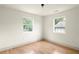 Bright bedroom with hardwood floors and ample natural light from two windows at 124 Richmond Se St, Atlanta, GA 30312
