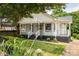 Lovely home with a covered porch, fresh landscaping and a beautiful lawn at 124 Richmond Se St, Atlanta, GA 30312