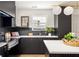 Sleek kitchen featuring modern appliances, dark cabinets and quartz countertops at 124 Richmond Se St, Atlanta, GA 30312