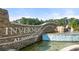 Impressive stone entrance with a water feature welcomes you to the beautiful Inverness at Sugarloaf community at 1307 Aura Ln, Lawrenceville, GA 30045