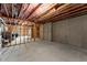 Spacious unfinished basement with exposed framework and concrete foundation walls at 2075 Parkhaven Ct, Roswell, GA 30076