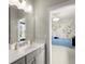 Bathroom featuring a large mirror, vanity, and a doorway leading to a bedroom at 2075 Parkhaven Ct, Roswell, GA 30076