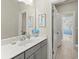 Bathroom featuring a sink, large mirror and a doorway leading to a bedroom at 2075 Parkhaven Ct, Roswell, GA 30076